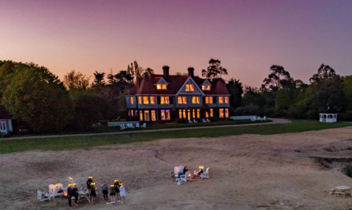 Manor house and beach at night Osea Island Events